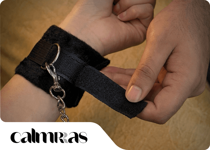 Black wrist restraint with a keychain by calmras
