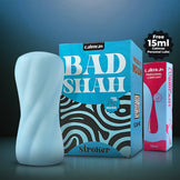 Calmras BadShah stroker with Calmras personal lubricant on a dark background